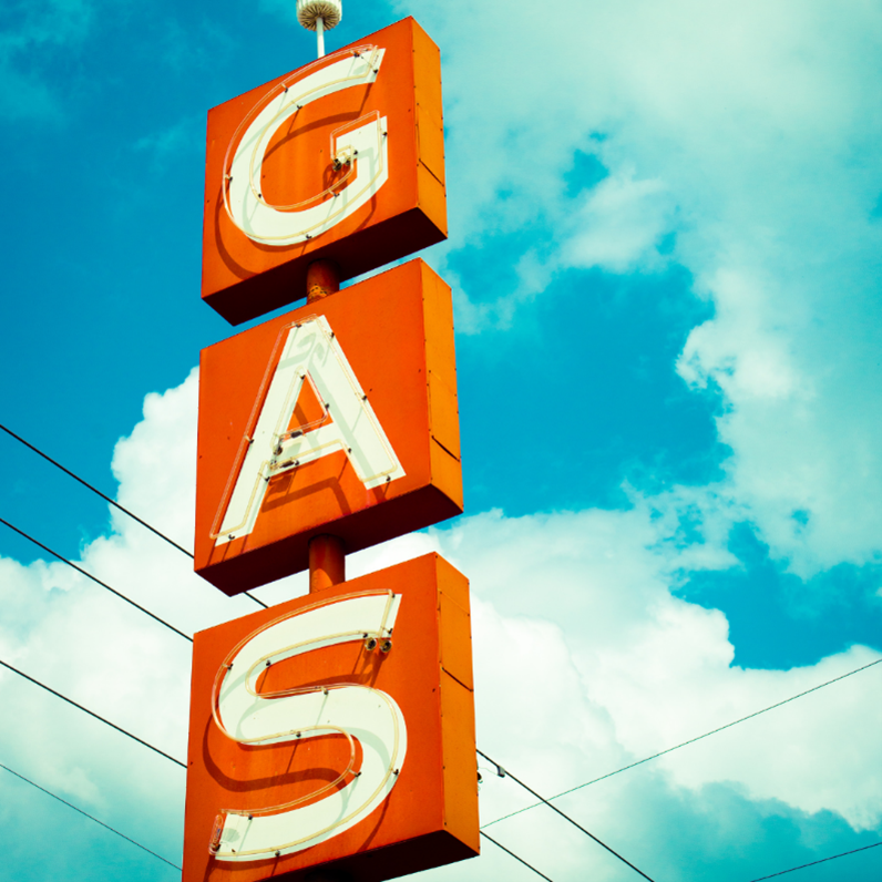 A gas station street sign